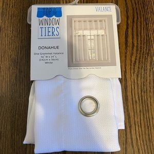 White valance. 54” wide. 14” long. 1 valance. Silver grommets.